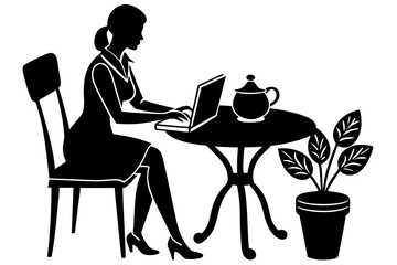 The woman is sitting at the computer