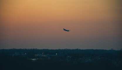 A plane taking of at sunset