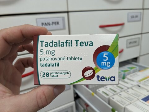Prague, Czech Republic - July 10 2024: TADALAFIL TEVA box of medication with TADALAFIL active substance by TEVA, used for treatment of erectile dysfunction and benign prostatic hyperplasia.	
