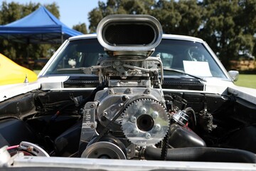 Powerful car engine with a supercharger at an outdoor car show in Isleton, CA