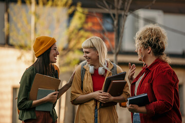 A Group of diverse students having fun outdoors in the city on a sunny summer day