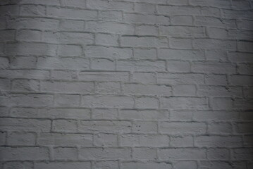 Construction, unusual imitations and drawings on fabric, fabric material. Beautiful masonry of gray, white bricks on a fabric background.