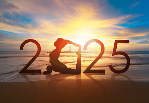 Happy new year card 2025. Silhouette of healthy girl doing Yoga One Legged Pigeon pose on tropical beach with sunrise or sunset sky background, woman practicing yoga as a part of the Number 2025 sign.