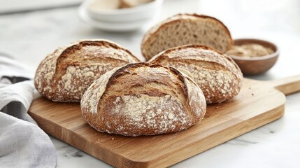Naklejka premium Artisanal rye bread loaves with a fresh look, perfect for any culinary setting. The rustic touch of artisanal rye bread enhances the visual appeal, complementing creative presentation.