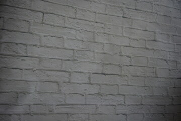 Construction, unusual imitations and drawings on fabric, fabric material. Beautiful masonry of gray, white bricks on a fabric background.