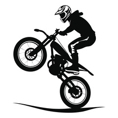 silhouette of a biker doing freestyle tricks
