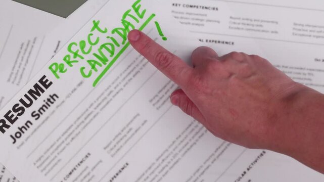Fake mock CV (curriculum vitae) resume for John Smith, selected by HR as the perfect candidate for a job. Concept of job search, employee selection, recruitment process, work and hiring.