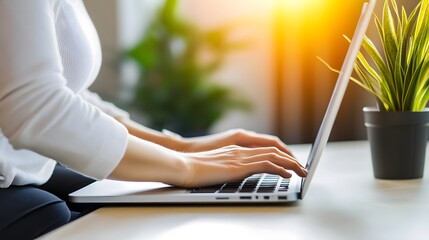 Person sitting at desk with poor posture, emphasizing the importance of ergonomic practices for maintaining health and productivity in the workplace.