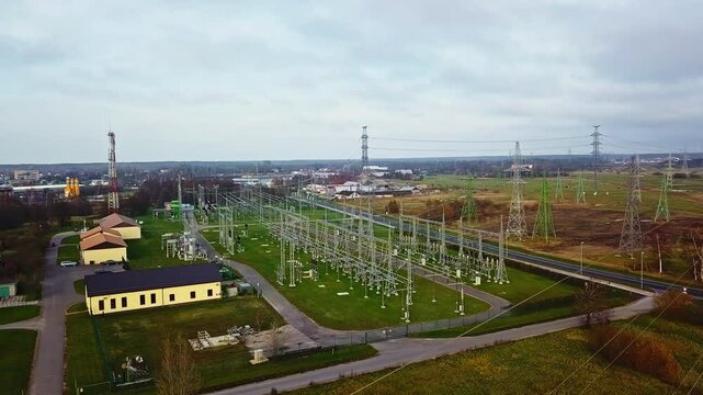 Large electric substation and transmission towers - aerial parallax
