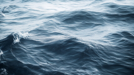 Fototapeta premium Close-up of ocean waves with dark blue tones.