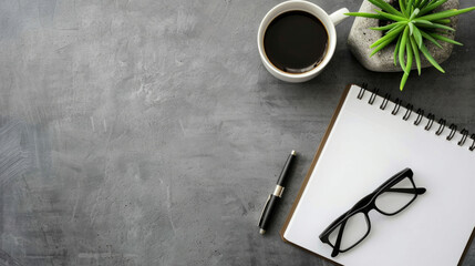 A cozy workspace setup featuring a notepad, glasses, a cup of coffee, and a succulent plant ready for brainstorming ideas