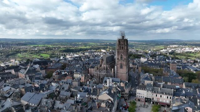 Rodez with its iconic cathedral and surrounding urban rooftops blending into green countryside