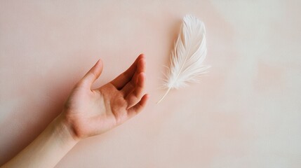 A gentle hand reaches towards a delicate white feather on a soft pink background, AI