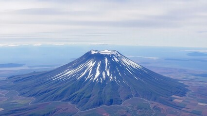 Fototapeta premium Majestic Snow-Capped Mountain Peak Aerial View: Perfect for Wall Art, Home Decor, and Nature Photography Enthusiasts