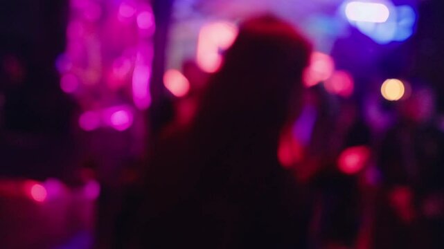 A captivating and blurry nightlife scene illuminated by colorful lights, creating an immersive and vibrant atmosphere