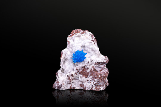 Cavansite crystals on stilbite photography isolated on black background. Specimen from Wagholi, India. macro detail close-up mineral crystal unpolished semi-precious gemstone.
