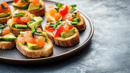 Colorful avocado and salmon bites arranged on toasted bread with fresh herbs for a delightful appetizer or snack option