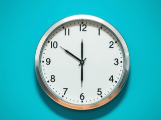 A silver shiny clock hanging at the wall with copy space in a minimalist room setting, copy space, wall