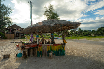Wooden tropical beach chair on sand local restaurant