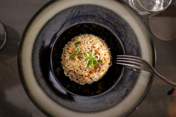 Fried rice asian cuisine restaurant plate overhead view modern presentation gourmet dining fresh garnish food