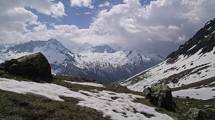 Majestic Snowy Mountain Landscape Under Cloudy Sky