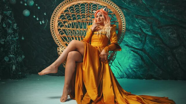 fantasy woman queen sits on throne hands with long golden sharp claws rings. Royal dress gold old style. Sexy beauty face fairy Girl Inari demon Kitsune, fox ears on head. elf princess in magic world