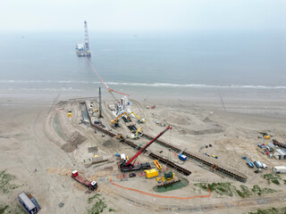 Connecting a seacable from an offshore windpark to an onshore power hub in Wijk aan Zee, the Netherlands