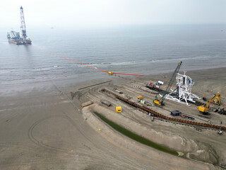 Connecting a seacable from an offshore windpark to an onshore power hub in Wijk aan Zee, the...