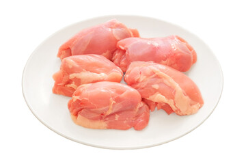 Boneless chicken thighs in plate. Cooking food at home. Isolated in white background. Raw chicken meat for cooking.