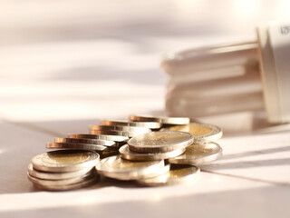 A lot of coins and light bulbs. Saving money and financial business concept.Copy space.