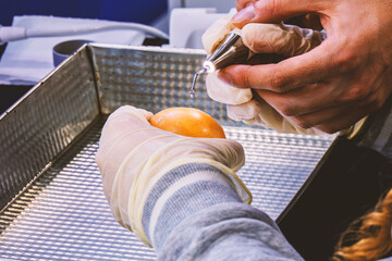 A woman trains using a frequency modulated ultrasound bone surgery machine to preserve soft tissue and improve tissue repair.