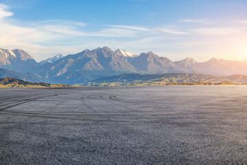 Asphalt road square and mountain natural landscape at sunset. car background.