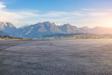 Selbstklebende Fototapeten Asphalt road square and mountain natural landscape at sunset. car background. © ABCDstock