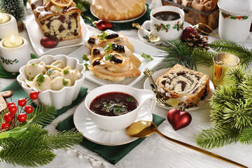 Christmas Eve supper with traditional dishes on festive table