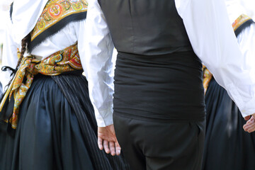 Dancers wearing one of the traditional folk costume from Galicia (Spain)