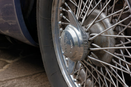 DUINO AURISINA, Italy - October 25, 2024: Detail of the wheel of a 1960s Jaguar vintage car