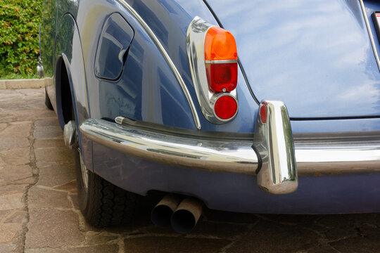 DUINO AURISINA, Italy - October 25, 2024: Detail of the rear side of the Jaguar 240 vintage car, produced in the years 1967-1969