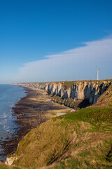 Wind turbines on limestone or chalk cliffs along English Channel shore near Cap Fagnet in Fécamp, Normandy, France