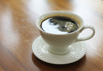 Hot black coffee in a glass on the table