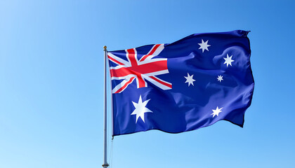 Australian flag waving in the clear blue sky capturing national pride and heritage during a sunny day