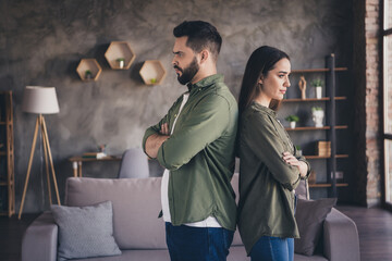 Photo of serious confident married guy lady wear casual shirts arms folded indoors room home house