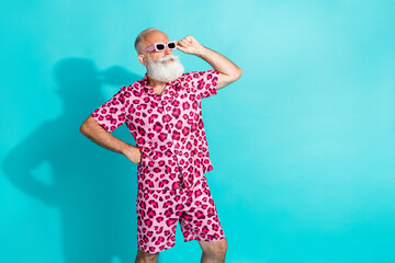 Photo of attractive senior bearded man confident look empty space dressed stylish pink leopard...