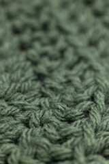 close-up of vertical crochet rows in sage green, crocheted or knitted, reminds you of grandma's house, cozy and warm background, macro, shallow Depth of field