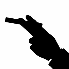 silhouette of hand holding cigarette