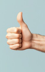 Hand giving a thumbs up gesture on a solid background.