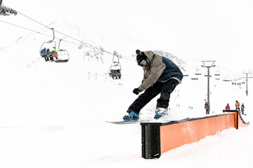 Riding the wall. Snowboarder demonstrates skillful tricks.