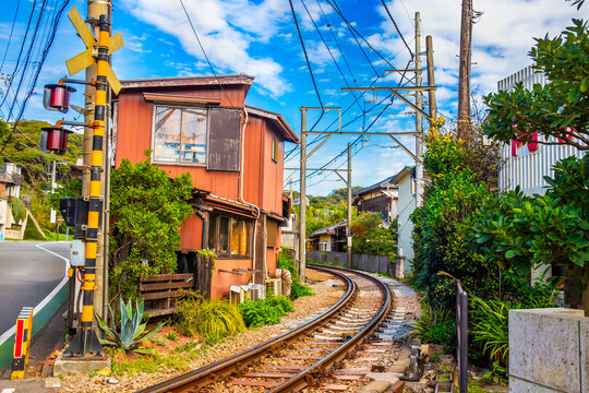 Kamakura's famous cafe next to the train tracks, sit or stand and eat food or drink and watch the trains pass by up close Japan