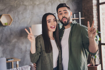 Photo of cheerful attractive married people buy flat moving relocation cosy modern loft interior apartment indoors