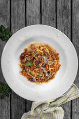 Delicious Plate of Puttanesca Pasta with Rich Tomato Sauce