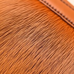 Fototapeta premium Close-up of a brown brush with leather trim.
